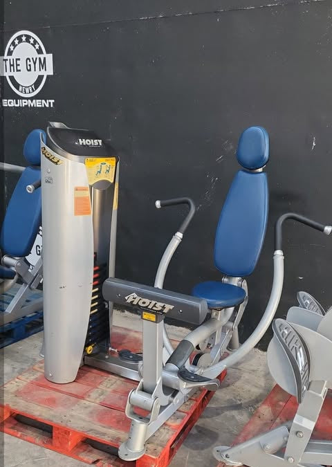 a set of weight training equipment, including a chest press machine and a hoist chest press.