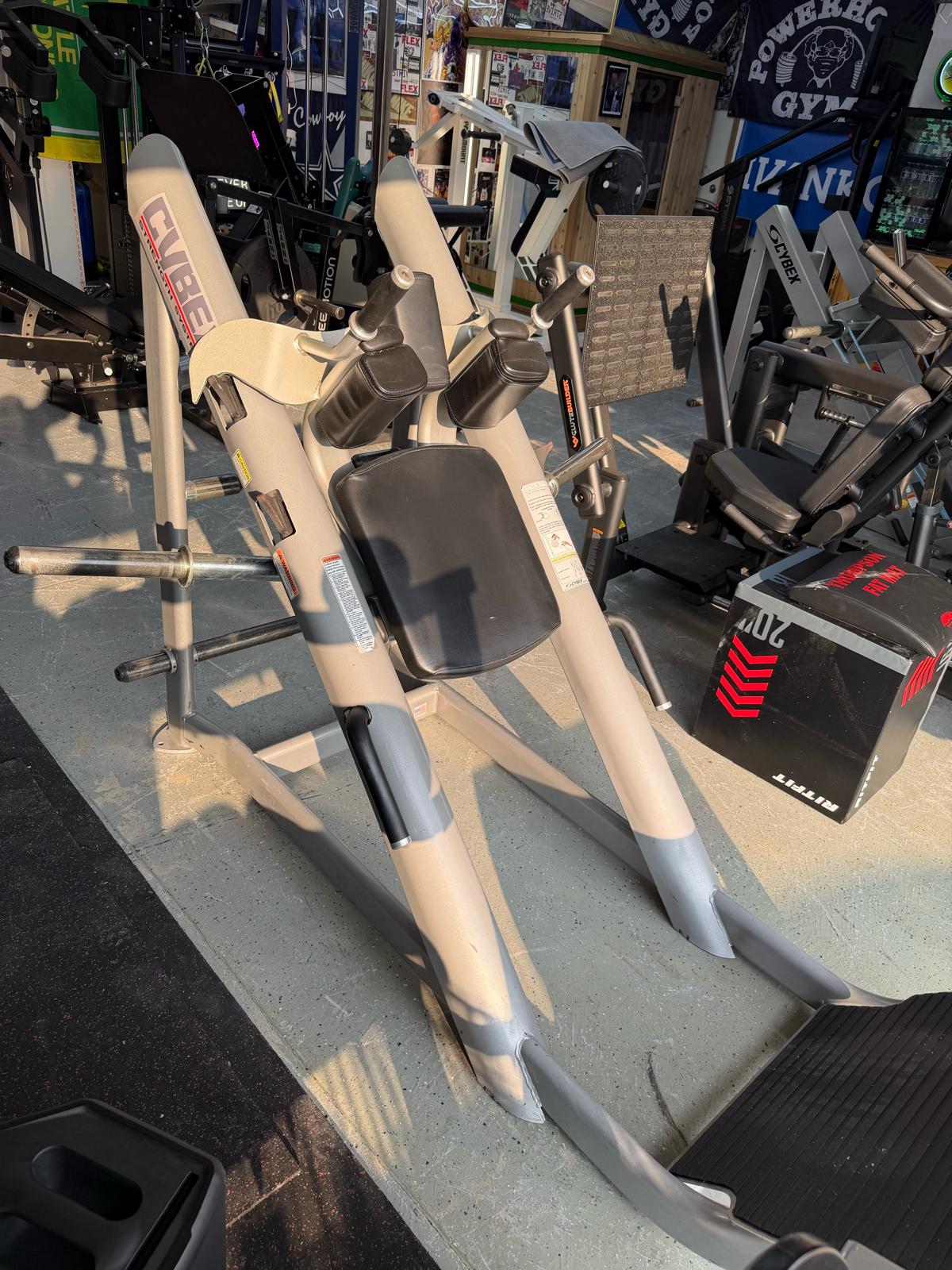 a variety of exercise equipment, including a weight machine, in what appears to be a gym or fitness center.