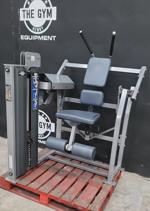 a weight training machine, specifically a hammer curl, designed for strength training the abdominal muscles.