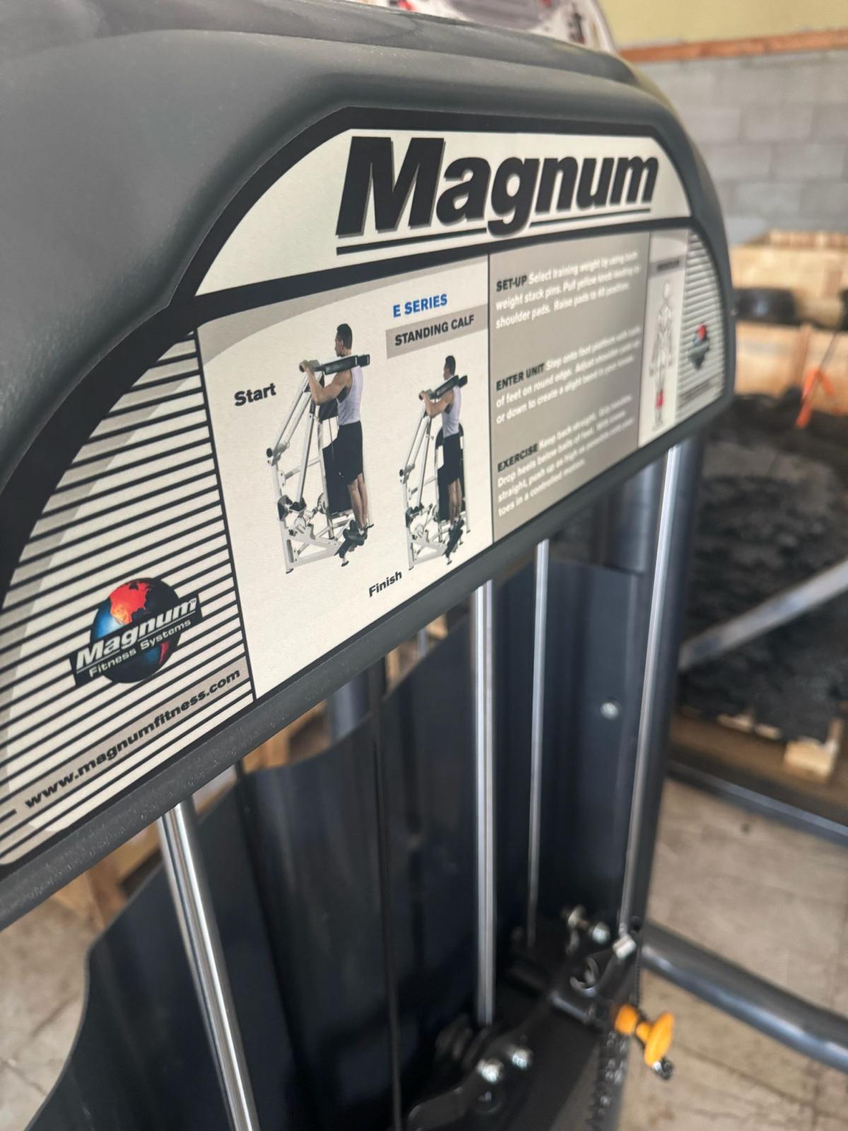 a close-up view of a weight training machine, specifically a leg press, with instructions and a website listed on the machine's label.