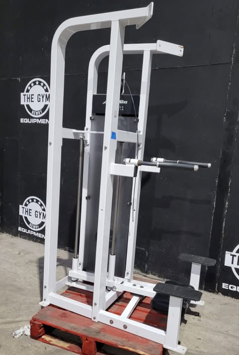 A white weight training machine with a black seat and a red platform, labeled as an "Assisted Dip/Chin" machine, is shown in the image.